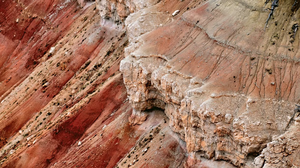 Aerial view of vibrant rock striations in Brian Head, Utah's rugged landscape.